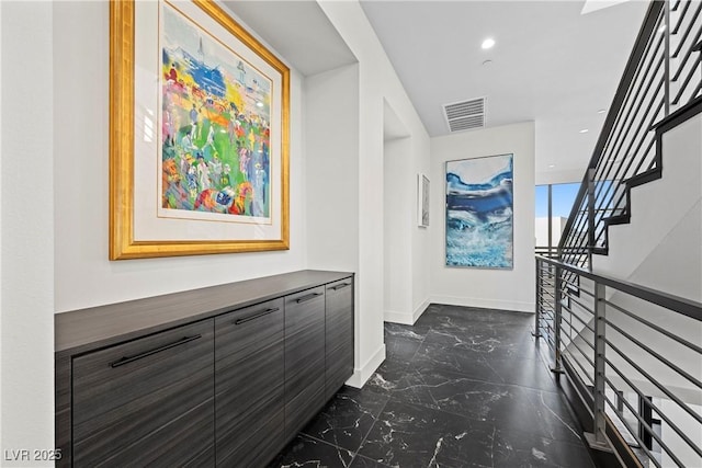 hall with marble finish floor, recessed lighting, visible vents, stairway, and baseboards