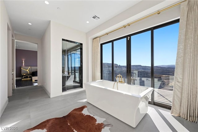 interior space featuring visible vents, a mountain view, and recessed lighting