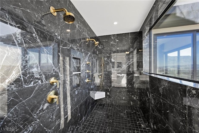 full bathroom with a marble finish shower