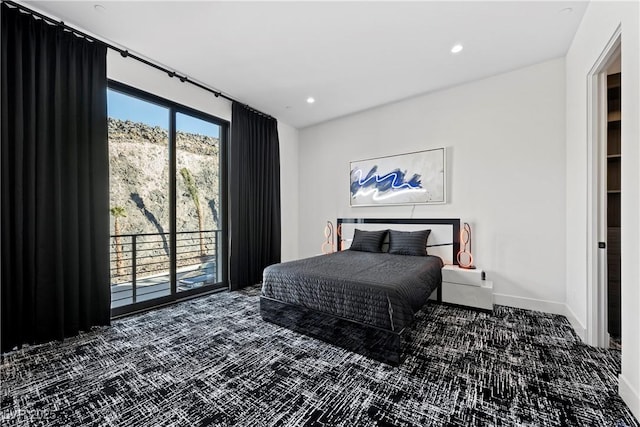 carpeted bedroom featuring access to outside, baseboards, and recessed lighting