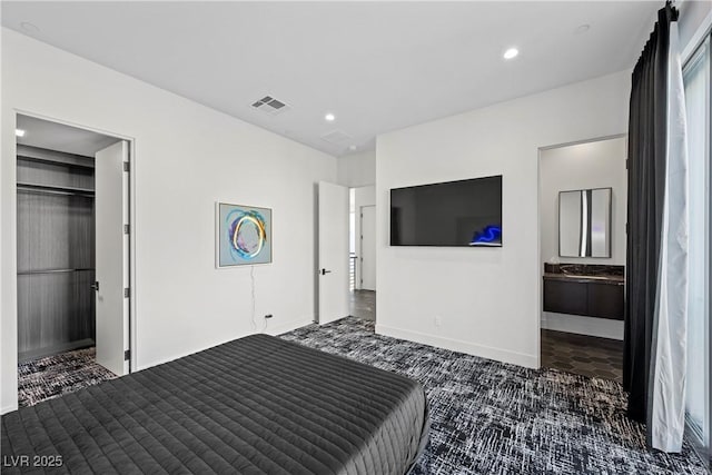 bedroom featuring ensuite bathroom, recessed lighting, carpet flooring, visible vents, and baseboards