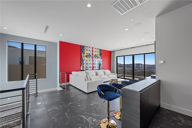 living room with marble finish floor, recessed lighting, visible vents, and baseboards