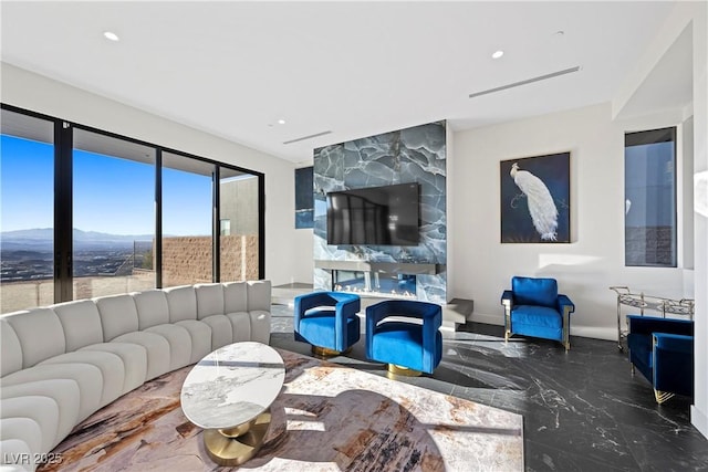 living room with visible vents, baseboards, a high end fireplace, marble finish floor, and recessed lighting