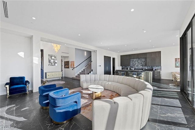 living area featuring marble finish floor, stairway, visible vents, and recessed lighting