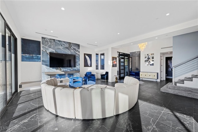 living area featuring stairs, marble finish floor, baseboards, and recessed lighting