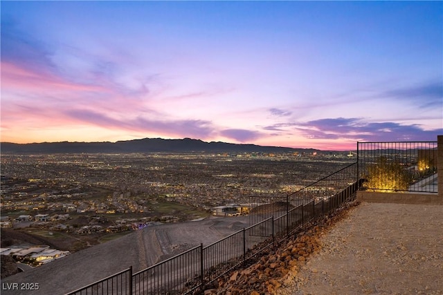 view of yard featuring fence and a mountain view