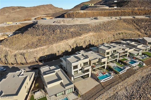 birds eye view of property with a residential view and a mountain view