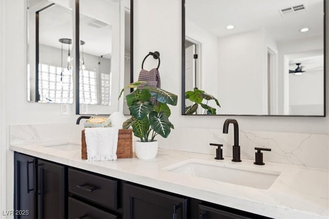 bathroom with ceiling fan and vanity