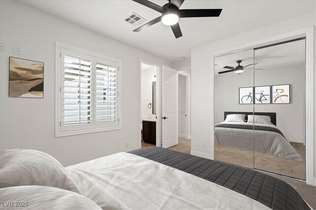 bedroom with ensuite bath, a closet, and ceiling fan