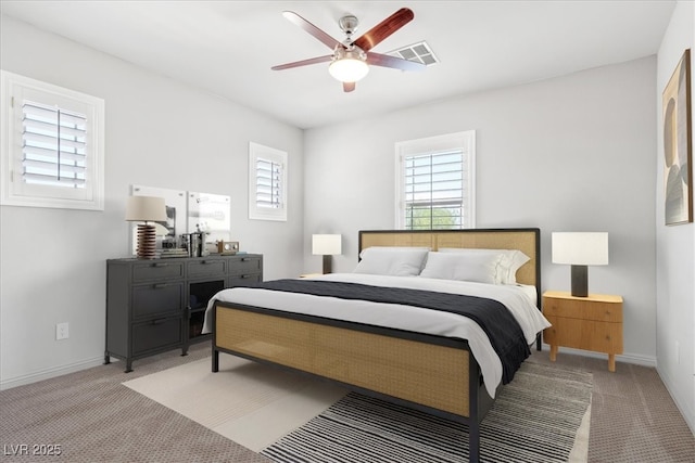 bedroom featuring ceiling fan and light colored carpet