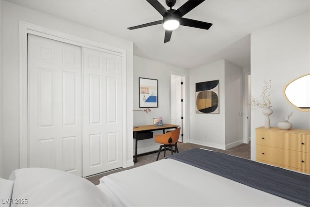 carpeted bedroom with a closet and ceiling fan