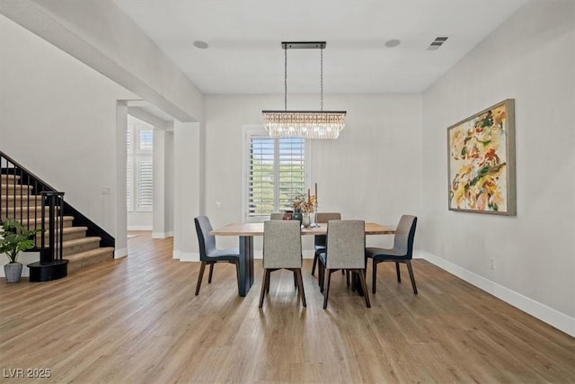 dining space featuring light hardwood / wood-style flooring