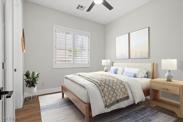 bedroom featuring hardwood / wood-style floors and ceiling fan