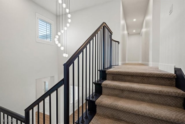 stairway featuring hardwood / wood-style flooring