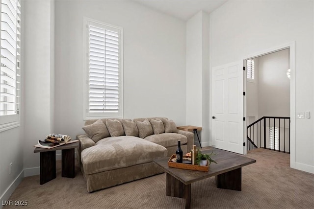 carpeted living room with a healthy amount of sunlight