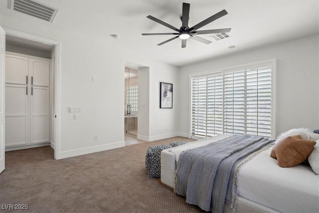 bedroom with light carpet, connected bathroom, and ceiling fan