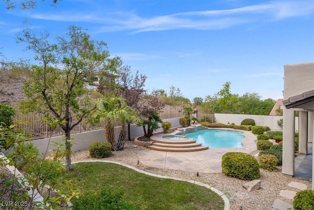 view of swimming pool featuring an in ground hot tub and a patio area