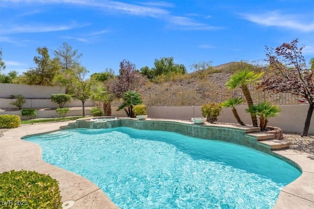 view of swimming pool featuring an in ground hot tub