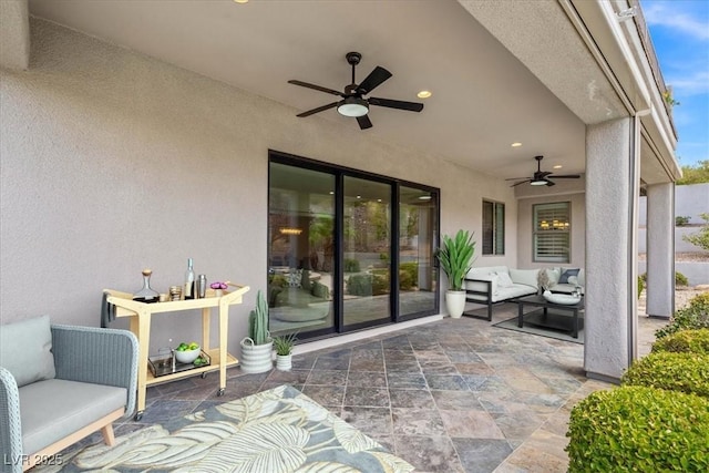 view of patio featuring an outdoor hangout area and ceiling fan