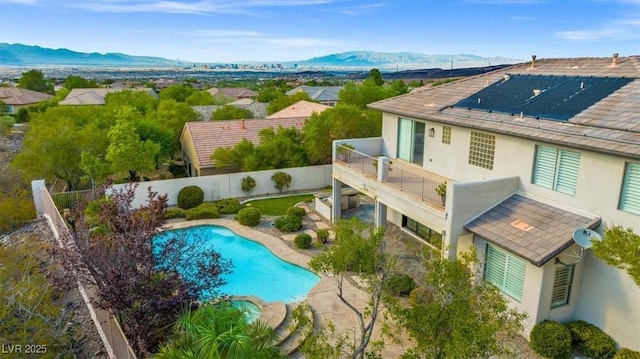 birds eye view of property with a mountain view