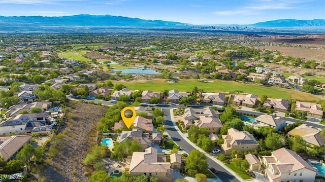 birds eye view of property featuring a mountain view