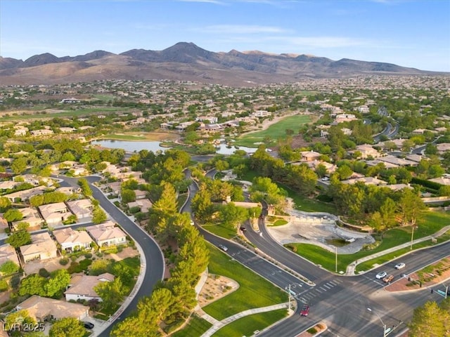 bird's eye view featuring a water and mountain view