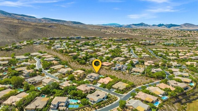 birds eye view of property featuring a mountain view