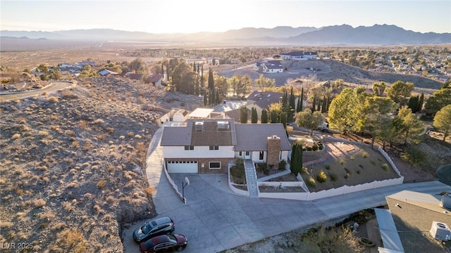 birds eye view of property featuring a mountain view