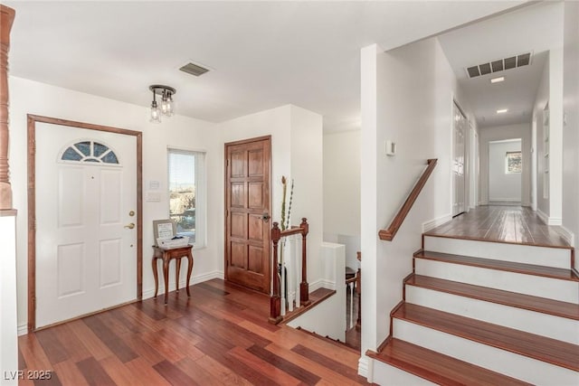 entrance foyer featuring dark hardwood / wood-style flooring