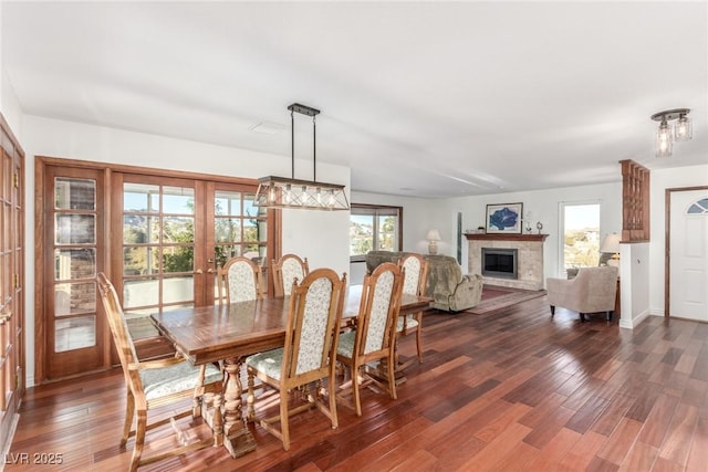 dining room with french doors and dark hardwood / wood-style floors