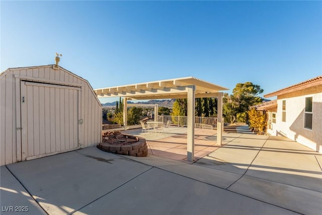 view of patio / terrace featuring a storage shed and a pergola