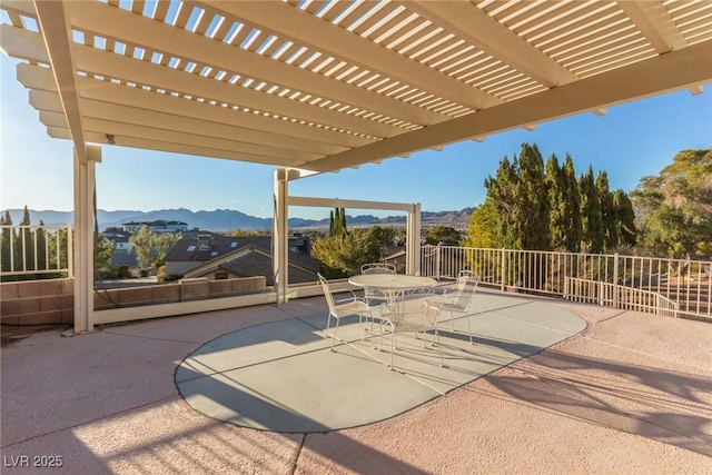 view of patio featuring a pergola and a mountain view