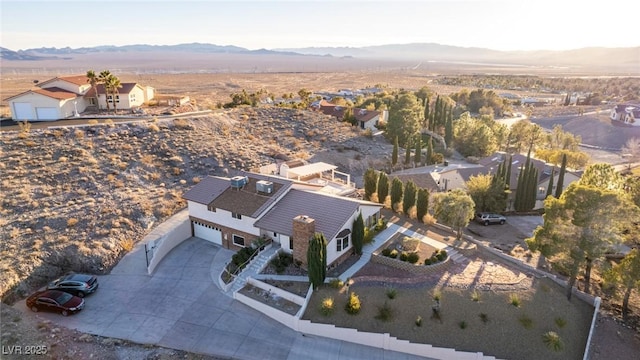 birds eye view of property with a mountain view