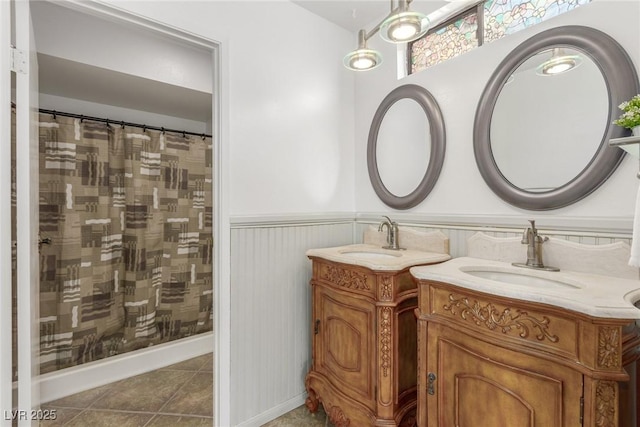 bathroom featuring a shower with shower curtain, vanity, and tile patterned flooring