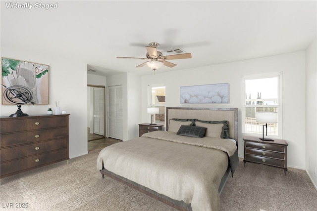 carpeted bedroom with ceiling fan