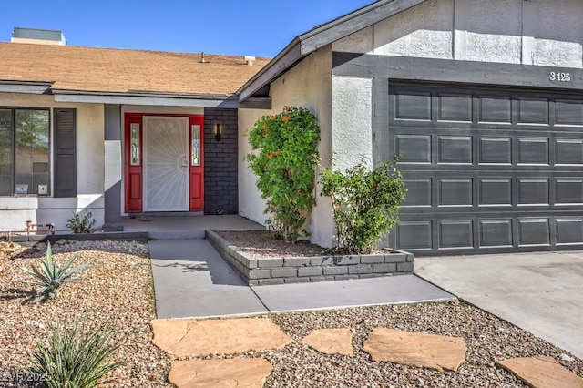 view of exterior entry featuring a garage