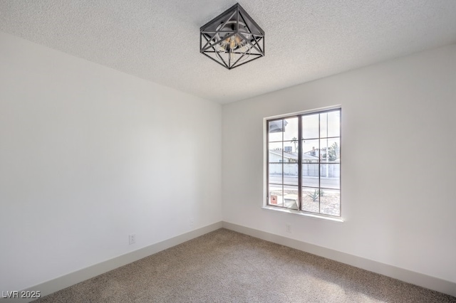 unfurnished room featuring a healthy amount of sunlight and a textured ceiling