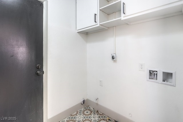 laundry room featuring cabinets, washer hookup, hookup for an electric dryer, and hookup for a gas dryer