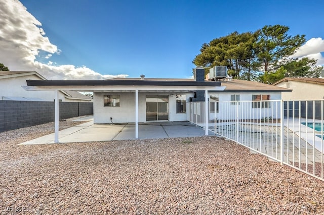 back of property featuring a patio and central AC