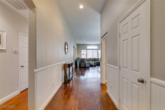 hall with hardwood / wood-style flooring