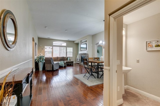 living room with hardwood / wood-style flooring and a fireplace