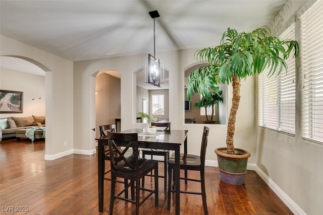 dining area featuring dark hardwood / wood-style floors