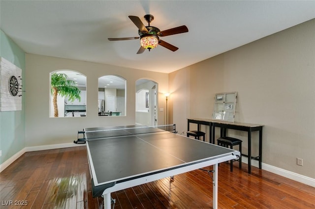 rec room featuring ceiling fan and dark hardwood / wood-style flooring