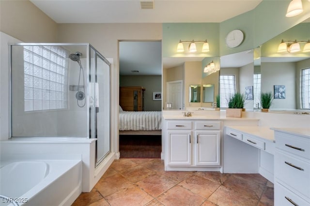 bathroom with vanity and separate shower and tub