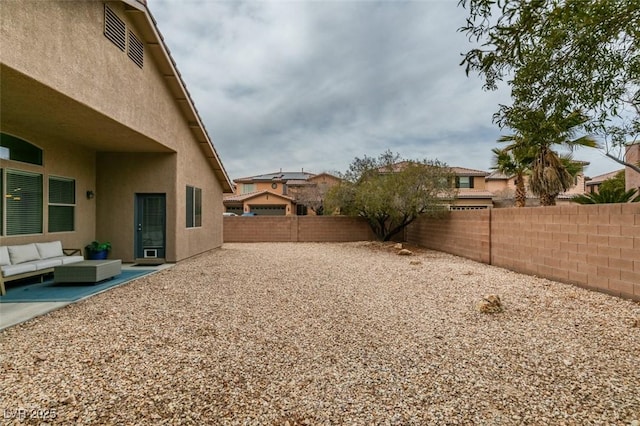 view of yard featuring an outdoor living space and a patio area