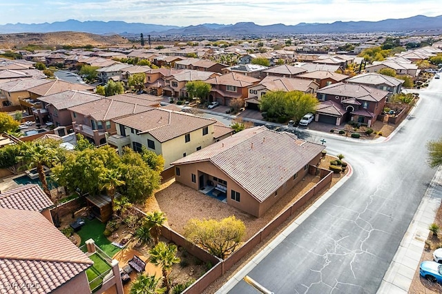 birds eye view of property featuring a mountain view