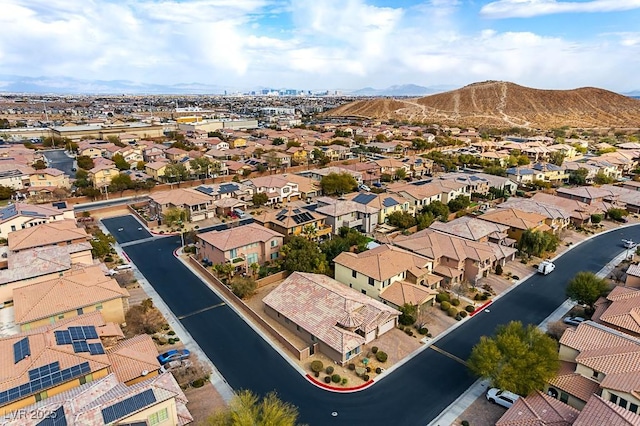 birds eye view of property with a mountain view