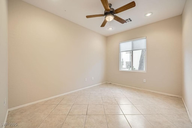 tiled empty room with ceiling fan