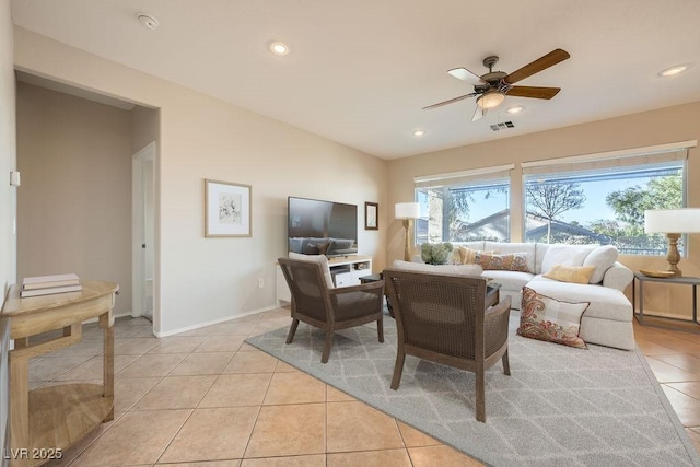 tiled living room with ceiling fan