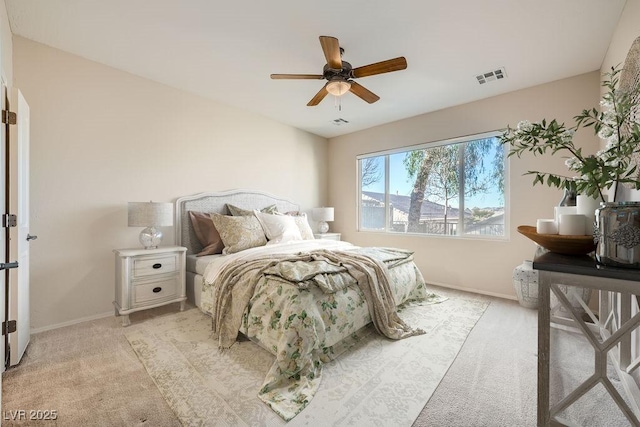 bedroom featuring light colored carpet and ceiling fan